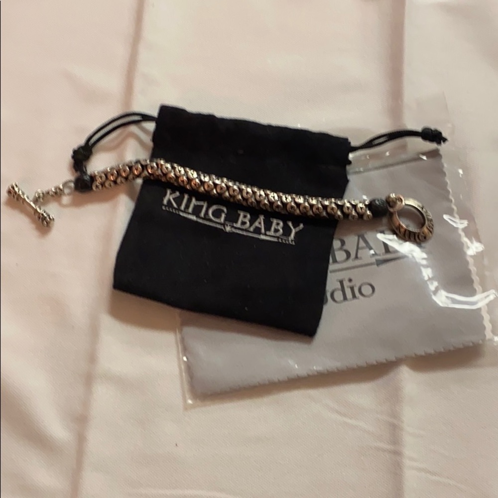 King baby, silver star bracelet w/ crown toggle.